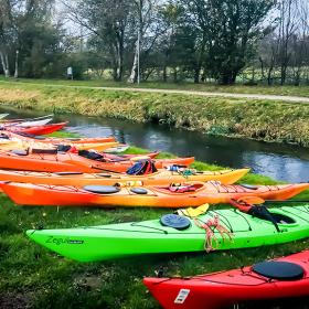 Kayaks at the bank of the Gudenå in Tørring